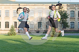 Excited happy girls school uniform jumping, sincere happiness concept