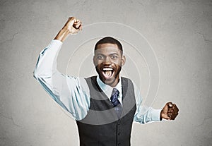 Excited happy man celebrates success, good outcome