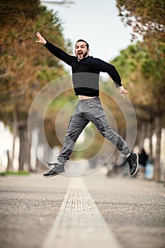 Excited Happy Man Jumping Up, Wearing Casual Clothes