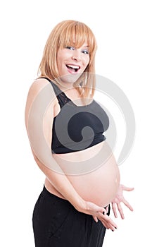 Excited and happy young pregnant woman smiling