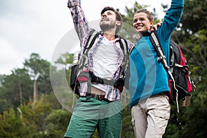 Excited hiker couple in forest