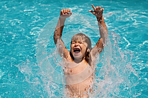 Excited kid boy in pool. Child swimming in water pool. Summer kids activity, watersports.