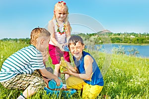 Excited kids pouring water