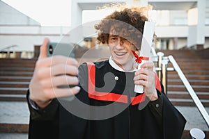 Excited male student in mantle scream graduate from university finish course studying. Happy man triumph holding college