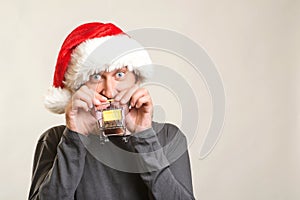 Excited man going to christmas shopping. Christmas sales and discounts. Handsome guy in Santa hat. Happy New Year. Christmas shop