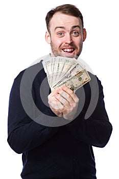 Excited man holding a fistful of money