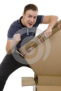 Excited man opening a parcel