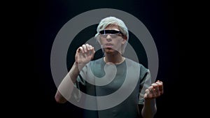 Excited man playing vr in futuristic glasses closeup. Happy teenager enjoying