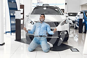 Excited Man Shouting Shaking Fists Buying New Car In Dealership