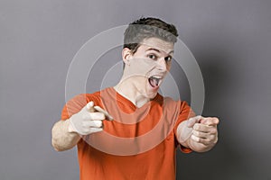 Excited man showing something with hands in cool manner