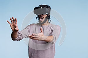 Excited man in vr glasses exploring virtual reality