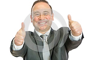Excited mature businessman giving thumbs up signal