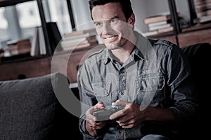 Excited mature gentleman playing video games