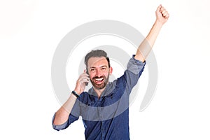 Excited mature man talking on mobile phone and laughing