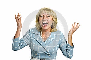 Excited mature woman raised hands.