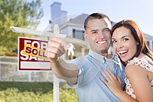 Excited Military Couple In Front of Home, House Keys and Sign