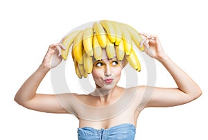 Excited model with bananas on head holding one in hand