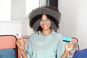 Excited multiracial female bank customer using phone to make easy secure payments online in convenient app