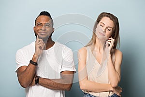 Excited multiracial man and woman hope for luck