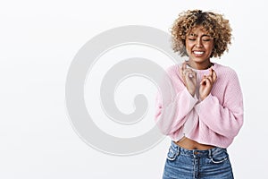 Excited and nervous cute african-american woman making wish and smiling cross fingers for good luck hope dream come true