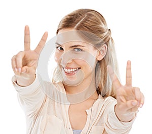 Excited, peace sign and portrait of woman in studio isolated on a white background. Face, fingers and v hand gesture