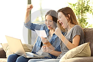Excited roommates reading a bank notification photo