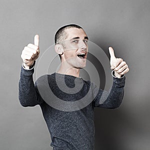 Excited 30s man with thumbs up for success photo