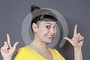 Excited 20s woman enjoying a LOL sign for fun and laughter