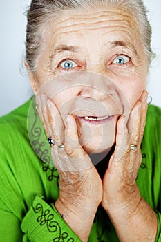 Excited senior woman with surprise expression