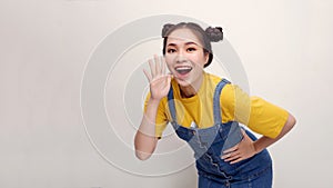 Excited shocked young woman 20s posing screaming with hands gesture near mouth looking camera isolated on white background