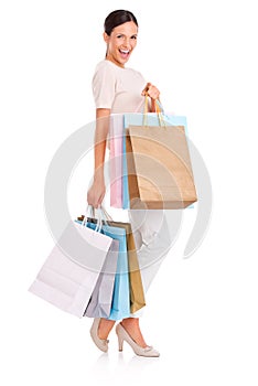 Excited, shopping bag and portrait of woman on a white background for sale, discount and deal news. Fashion, happy