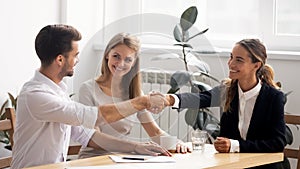 Excited smiling caucasian business people handshaking greet each other