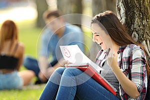 Excited student checking an approved exam photo