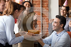 Excited team congratulate colleague in office making birthday present