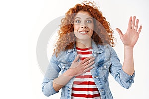 Excited upbeat good-looking redhead woman swear pledge allegiance raising one palm hold hand heart promise tell only