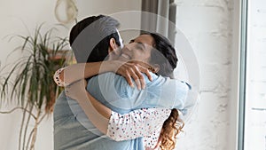 Excited wife holding beloved husband in arms grateful for support