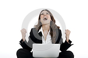 Excited woman with arms up winning online