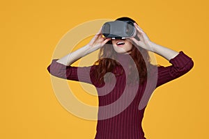 Excited woman experiencing virtual reality in headset