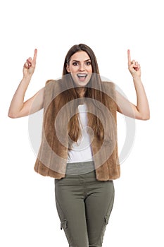 Excited Woman In Fur Vest Shouting And Pointing Up
