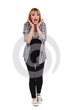 Excited Woman Is Holding Head In Hands And Shouting