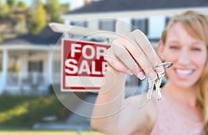 Excited Woman Holding House Keys and For Sale Real Estate Sign i