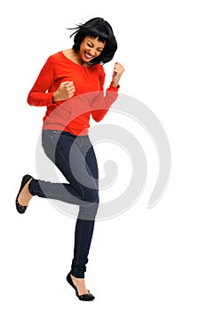 Excited woman jumps in joy