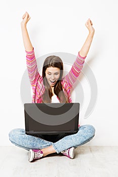 Excited Woman and Laptop Raise Arms, Happy Girl have Success in Computer, Sitting on Floor on White