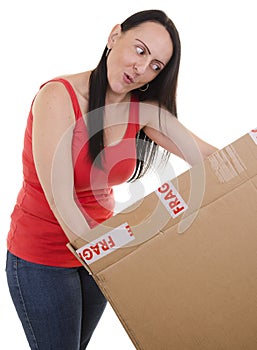 Excited woman opening a parcel