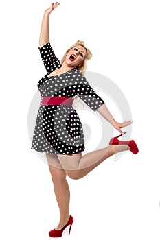 Excited woman posing in one leg
