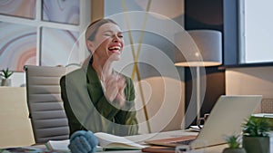 Excited woman reading great news on laptop screen sitting luxury office closeup