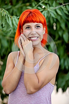 Excited woman with red hair enjoing a relaxed day