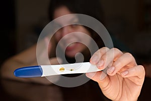 Excited Woman Showing Off Her Pregnancy Test