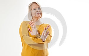 Excited woman showing the sign of stop, neglect, negation and reluctance photo