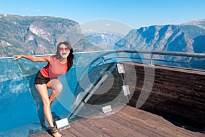 Excited woman tourist at Stegastein Viewpoint